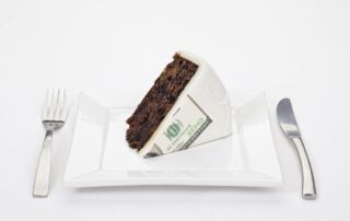 Dollar bill printed on slice of cake