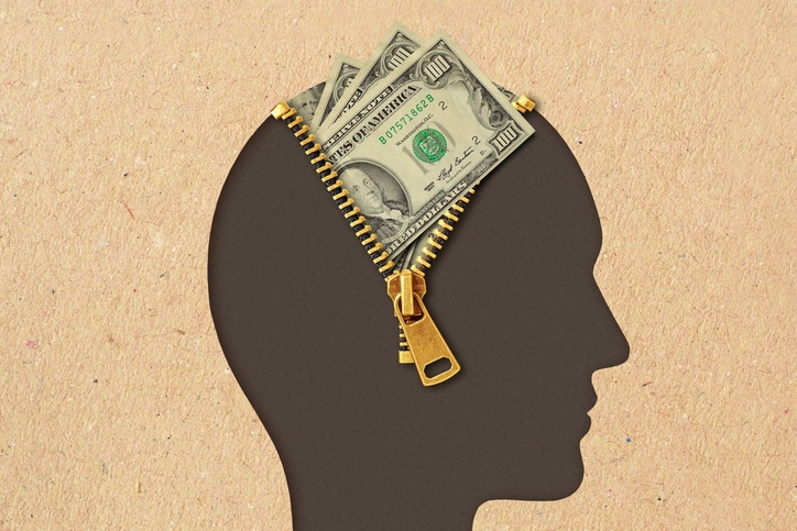 Man head profile with open zipper and dollar banknotes - Concept of thinking about money and financial success